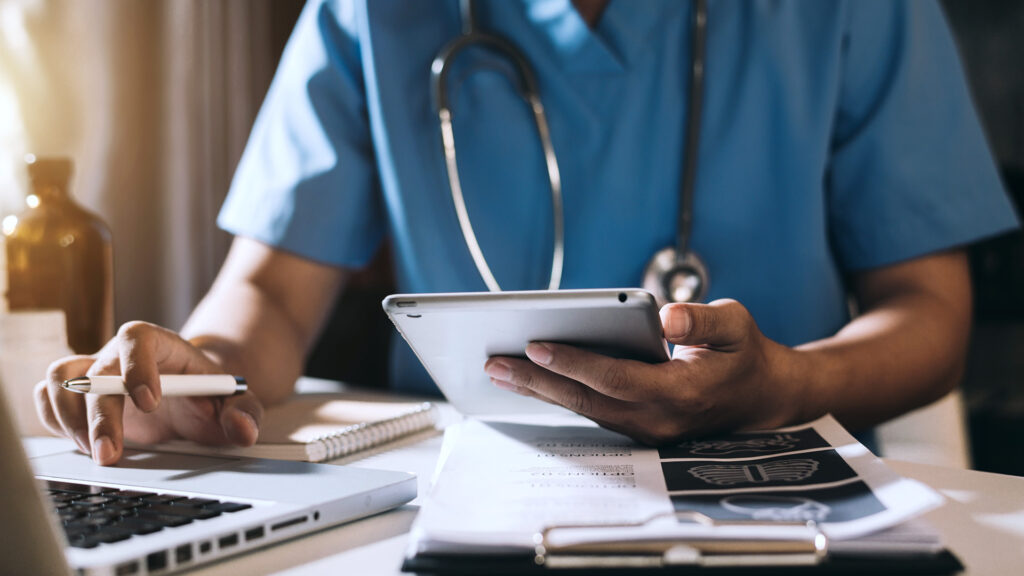 The Power of Practice Management Applications African Doctor with iPad